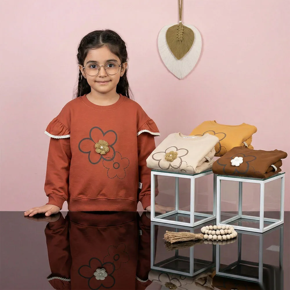 بلوز دخترانه طرح گل بالکدار رنگ نسکافه ای جنس پنبه